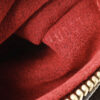 Red interior of Louis Vuitton Vivacite MM Monogram Canvas Handbag