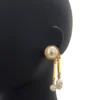 Chanel Gold and Pearly White Pendant Earrings 2026 Metiers D'Art