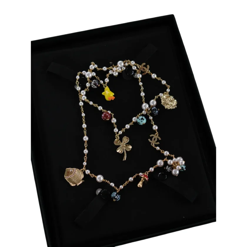Chanel Multi Charm Long Necklace Resin Pearl Gold tone Metal Fall Winter 2026 ABI152B26429UE291