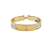 Hermès Clic H Guepards PM Bracelet Yellow gold plated metal back